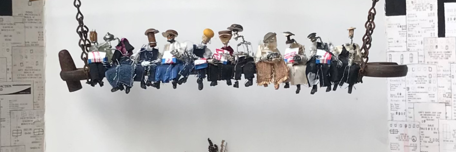 Close up of miniature figures from Lunch Atop a Skyscraper