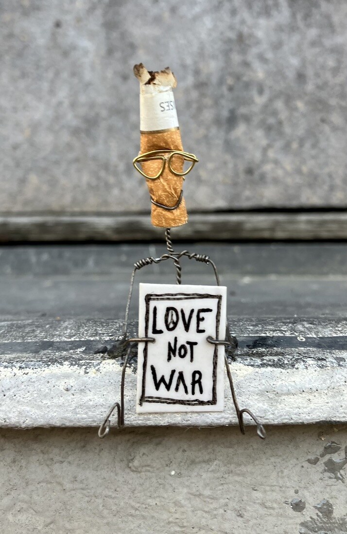 Peaceful Demonstrator carrying the message Love not wars